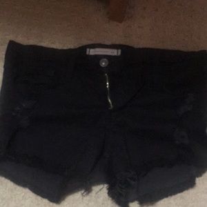 Edgy distressed black shorts